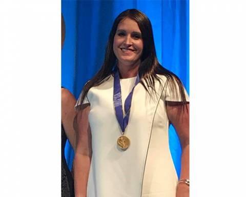 Brad Winget's daughter wearing Utah's Best Vacation Rentals' Best of State medallion award.