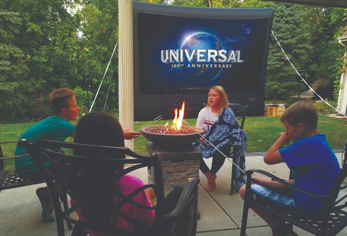Firepit and outdoor theater screen for family unions presented by Utah's Best Vacation Rentals.